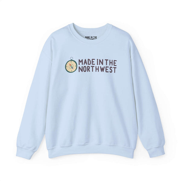 Light blue sweatshirt with 'Made in the Northwest' logo and compass design, perfect for showing Pacific Northwest pride.