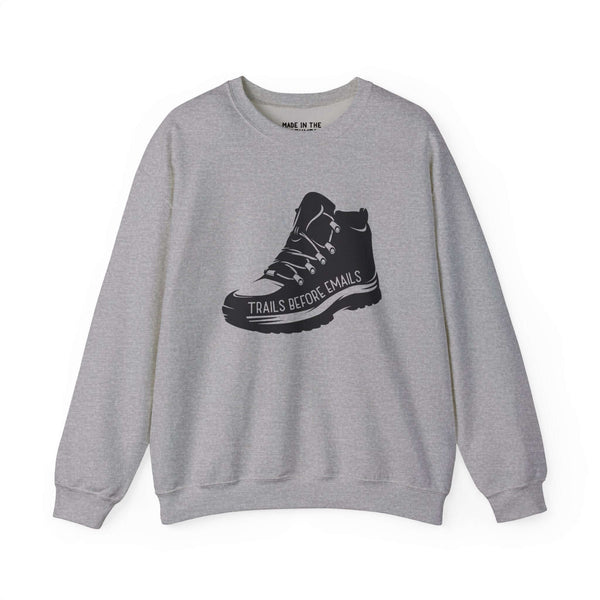Gray sweatshirt featuring a rugged hiking boot graphic and the text 'Trails Before Emails'.