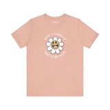 Pink premium tee with smiling daisy graphic and text 