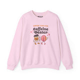 Pink sweatshirt with playful 'Support Your Local Caffeine Dealer' graphic featuring coffee cup and donut.