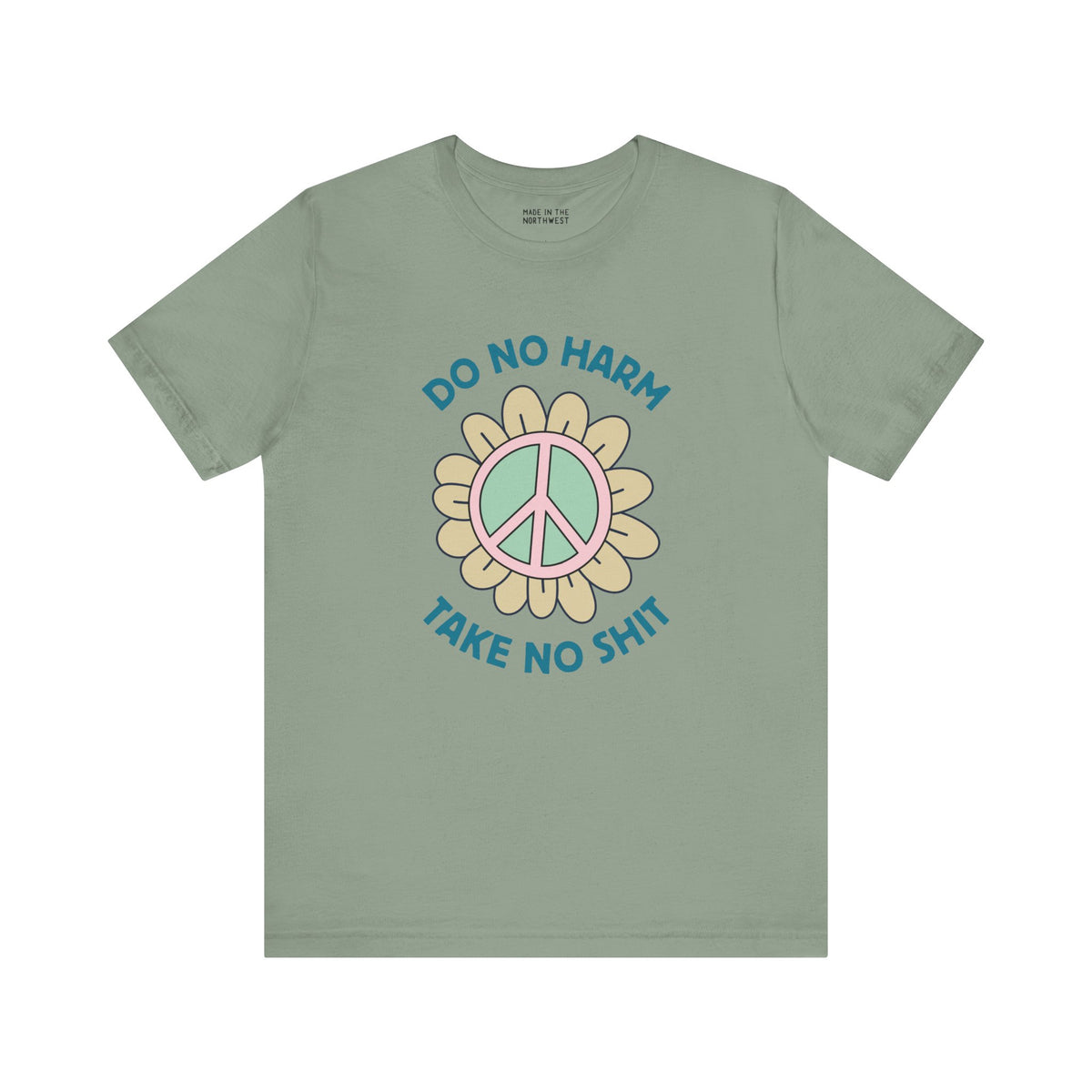 Do No Harm Take No Sh!t premium soft tee with peace flower design on a muted green shirt.