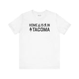 Home is in Tacoma tee featuring PNW symbols on a white shirt, celebrating Tacoma's grit and creative spirit.