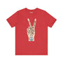 Power in Peace Premium Soft Tee featuring a hand with peace sign and uplifting words in a vibrant red color.