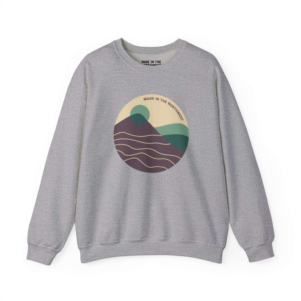 Gray sweatshirt with Pacific Peaks Modern Circle mountain scene design in earthy tones, capturing the beauty of the Pacific Northwest.