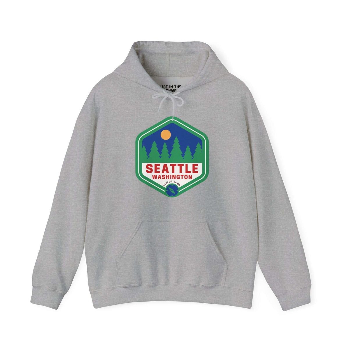 Gray Seattle hoodie featuring a retro 90s badge with trees, symbolizing the city's urban and natural Pacific Northwest blend.