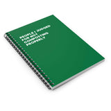 Green spiral notebook titled 'People I Judged for Not Composting Properly' for eco-conscious journaling.