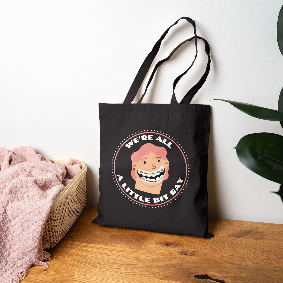 We're All a Little Bit Gay tote bag featuring playful design, perfect for expressing pride and joy.