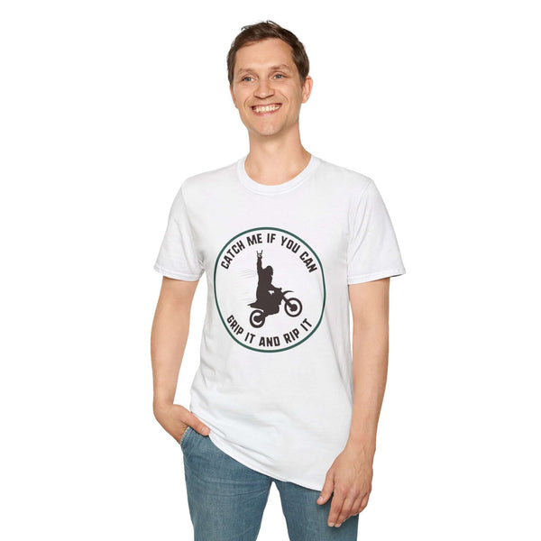 Man wearing a white t-shirt featuring a Bigfoot motocross design with the phrase 'Catch Me If You Can'.