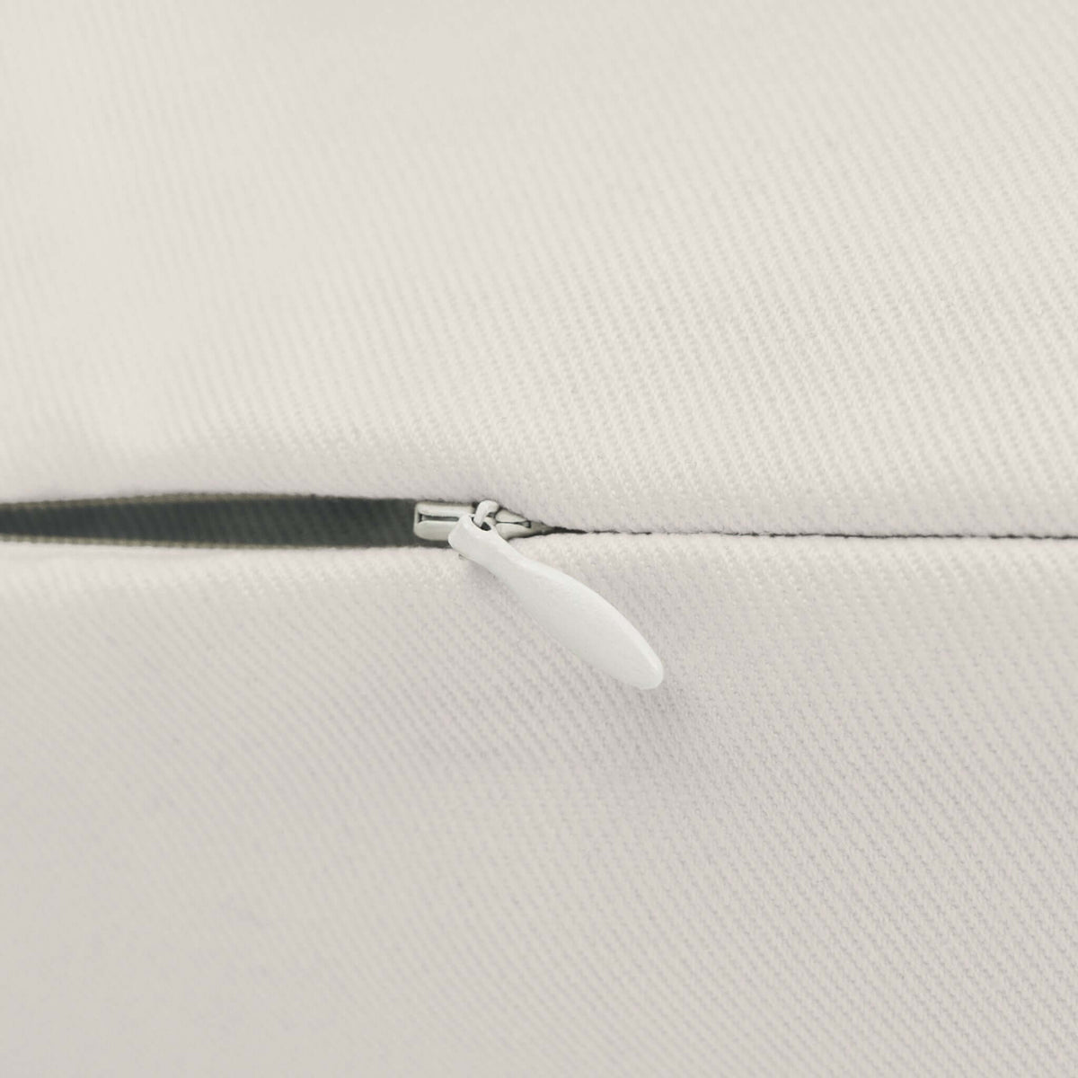 Close-up of the zipper on the Home is in Tacoma Lumbar Accent Pillow showcasing its quality craftsmanship.