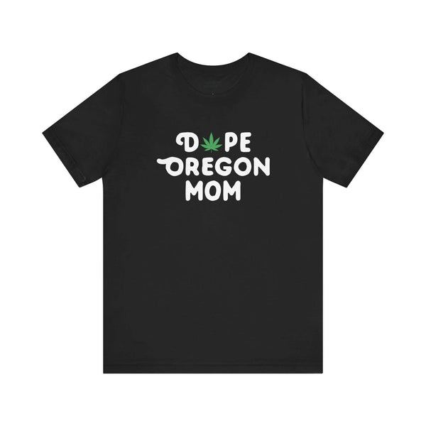 Black tee with "Dope Oregon Mom" text and marijuana leaf replacing the "O" in "Dope," showcasing Oregon pride for laid-back moms.