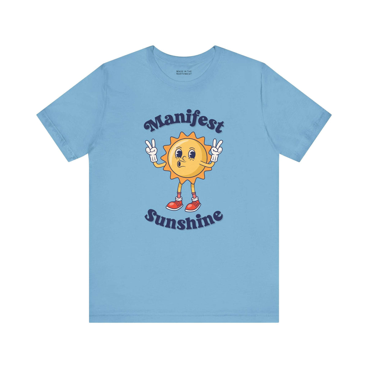 Manifest Sunshine T Shirt featuring a cartoon sun and positive vibes design on a light blue background.