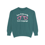 True Crime Is My Love Language Sweatshirt featuring heart-shaped handcuffs design on a teal background.