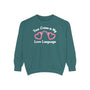 True Crime Is My Love Language Sweatshirt featuring heart-shaped handcuffs design on a teal background.