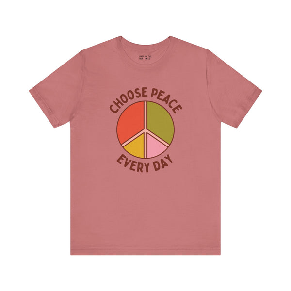 Choose Peace Every Day premium soft tee with colorful peace symbol design on a pink background.