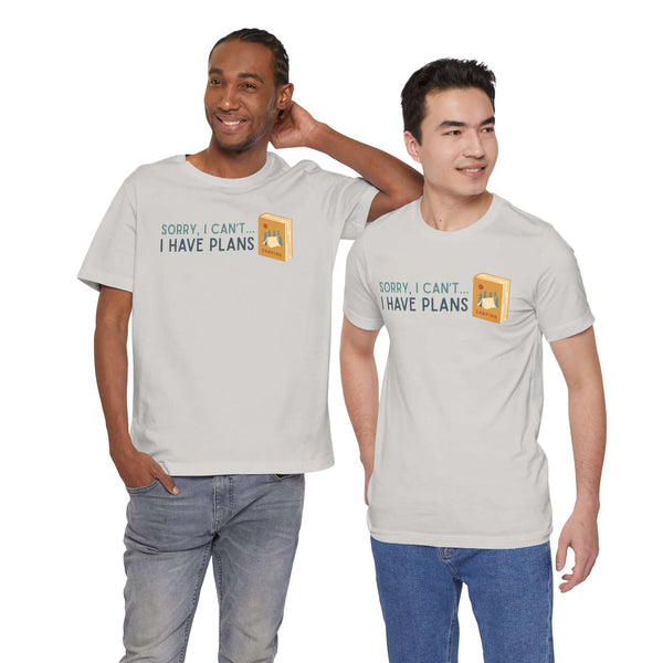 Two men wearing the 'Sorry I Can't - I Have Camping Plans' premium soft tee, showcasing a fun outdoor and reading theme.