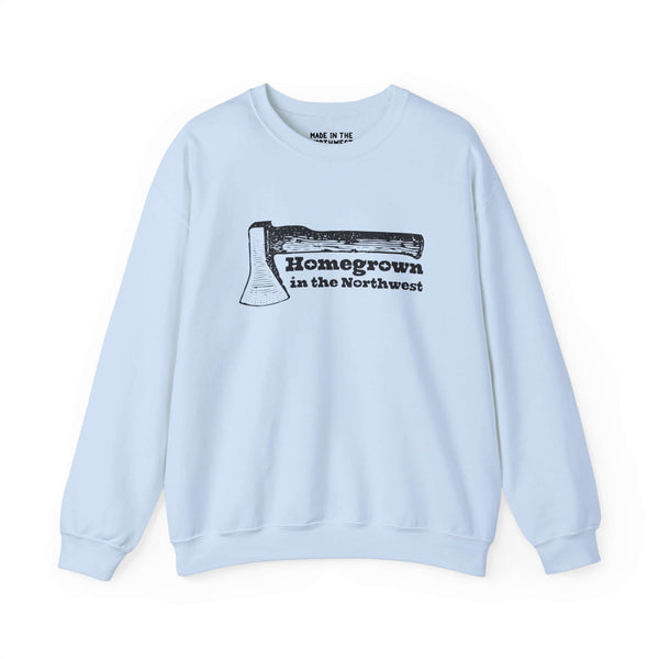 "Homegrown in the Northwest sweatshirt with rugged axe design, celebrating Pacific Northwest spirit on a light blue fabric."