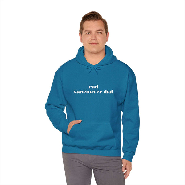 Man wearing a blue Rad Vancouver Dad hoodie, showcasing a casual and stylish urban look.