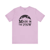 Made in the PNW T Shirt – Distressed Mountain Graphic Tee on a light purple background.