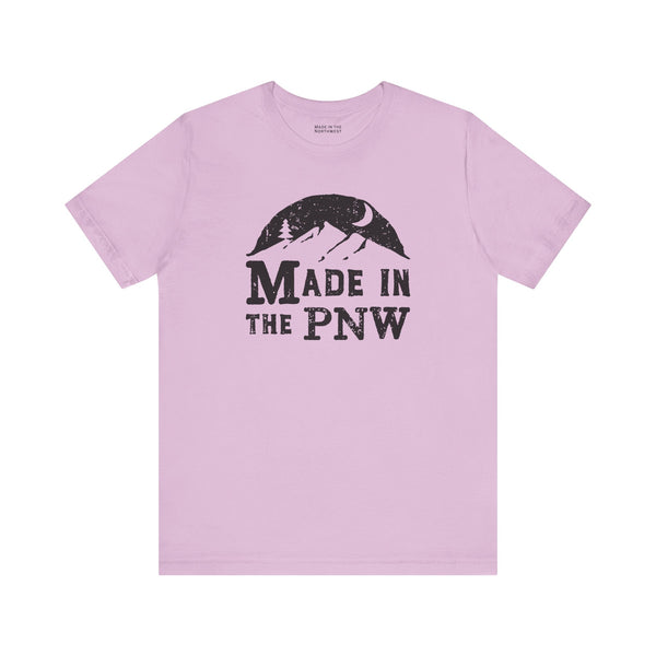 Made in the PNW T Shirt – Distressed Mountain Graphic Tee on a light purple background.