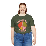Model wearing Choose Peace Every Day premium soft tee with colorful peace symbol on olive green fabric.