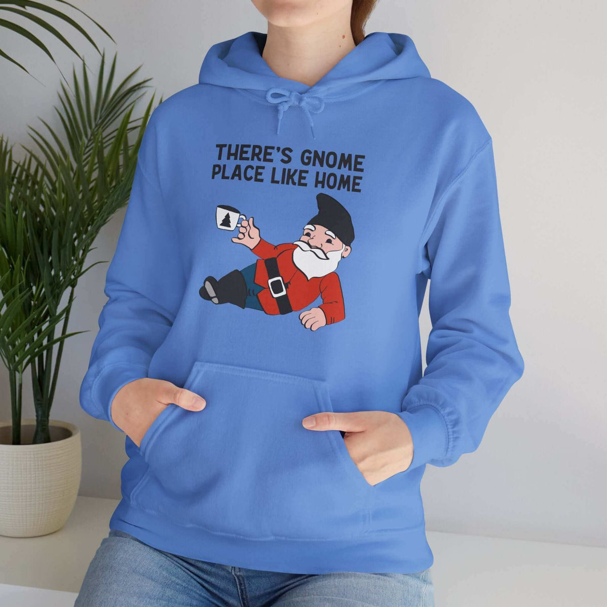 Blue hoodie with playful gnome design and 'There's Gnome Place Like Home' text. Cozy and whimsical fashion statement.