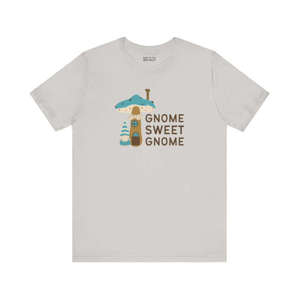 Gnome Sweet Gnome unisex tee featuring a gnome by a mushroom house, perfect for woodland whimsy lovers.