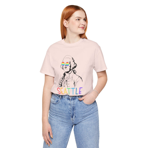 Model wearing George's Rainbow Vision Seattle tee with rainbow lettering and line art of George Washington.