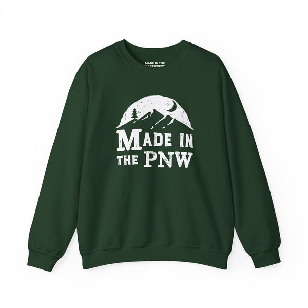Made in the PNW sweatshirt featuring a mountain graphic on a green crewneck sweater.