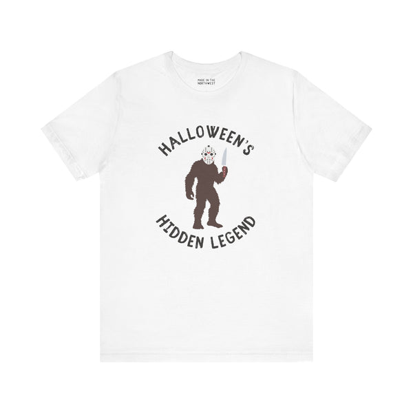 Bigfoot Halloween tee featuring a creature in a mask holding a knife, perfect for spooky season and Sasquatch fans.