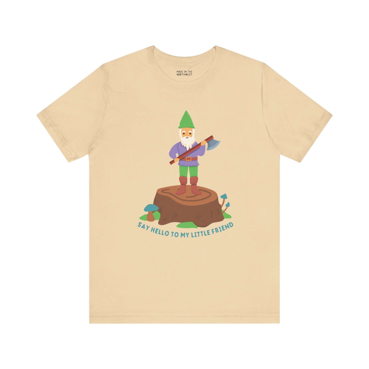 Beige tee with a gnome on a stump holding an axe; text reads 'Say Hello to My Little Friend' in playful design.