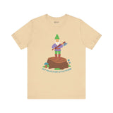 Beige tee with a gnome on a stump holding an axe; text reads 'Say Hello to My Little Friend' in playful design.