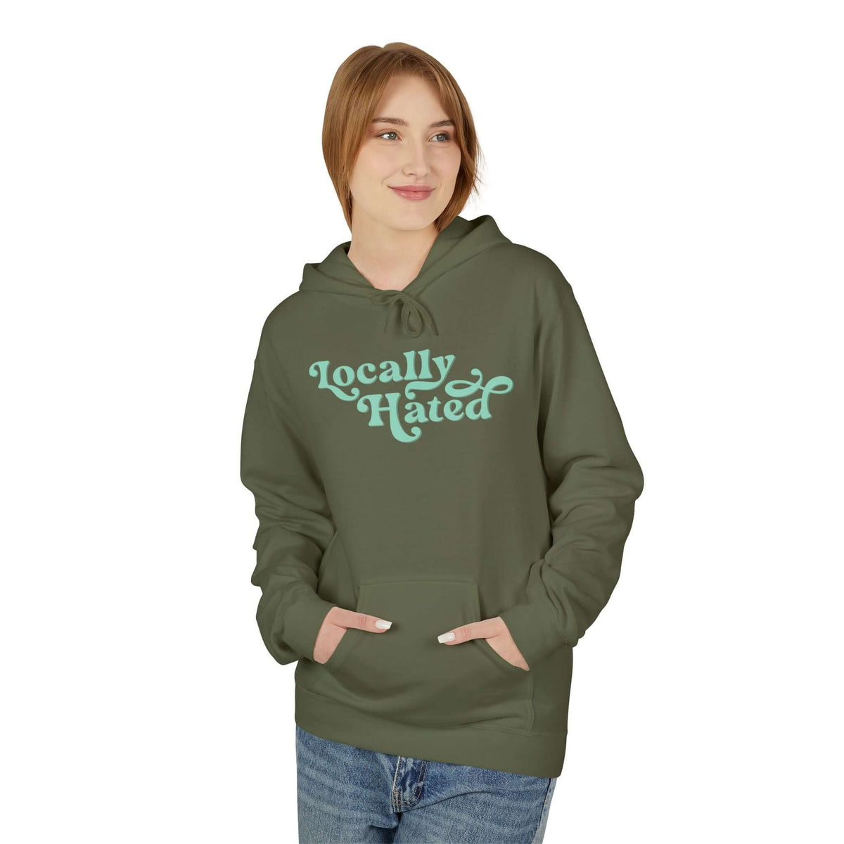 Locally Hated Hoodie – Cheeky Retro Script Sweatshirt in green worn by a smiling woman.