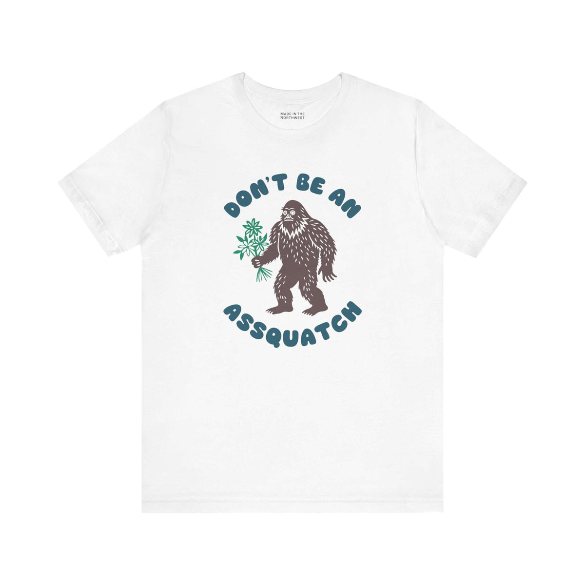 Don’t Be an Assquatch Tee featuring a friendly Bigfoot holding flowers on a white shirt.