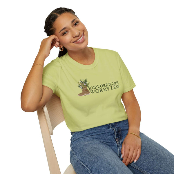 Unisex softstyle t-shirt featuring 'Explore More Worry Less' design with watercolor hiking boot and nature motifs.