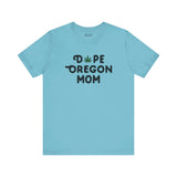 Light blue 'Dope Oregon Mom' tee with marijuana leaf replacing 'O', celebrating chill Oregon motherhood style.