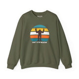 Don't Stop Believin' Bigfoot sweatshirt featuring playful sasquatch graphic and vibrant stripe design.