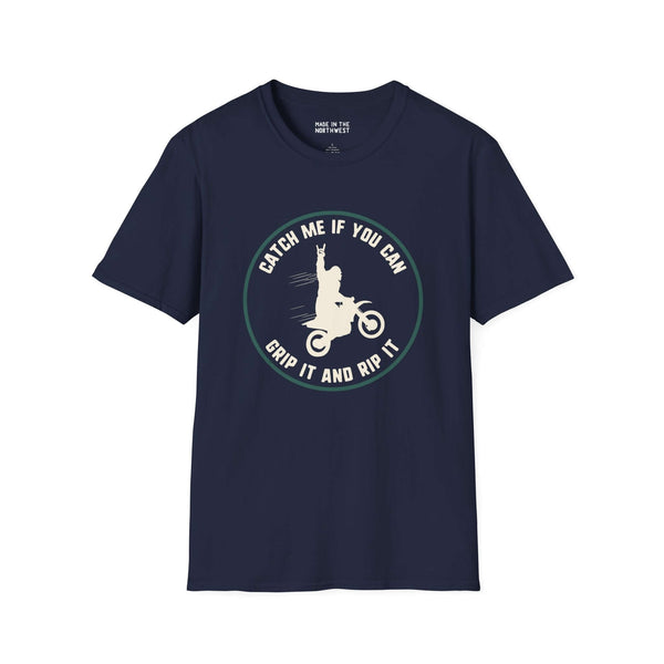 Trying to Catch Bigfoot Motocross Softstyle T-Shirt featuring Sasquatch on a bike with 'Catch Me If You Can' print.