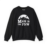 Made in the PNW sweatshirt showcasing a distressed mountain design on a black crewneck.