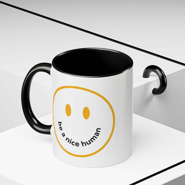 Be a Nice Human Mug with hand-drawn smile and contrasting black handle, perfect for daily use.