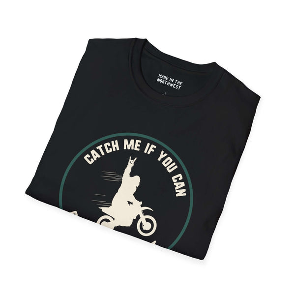 Black Trying to Catch Bigfoot motocross t-shirt with Sasquatch graphic and 'Catch Me If You Can' text.