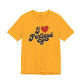 I love Portland t shirt in yellow with cursive design, showcasing hometown pride and creativity.