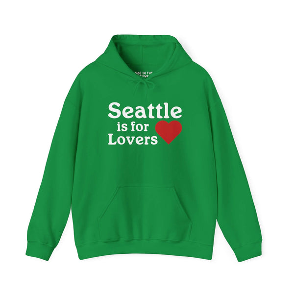 Green hoodie with "Seattle is for Lovers" design and heart graphic, celebrating the charm of Seattle's culture and skyline.