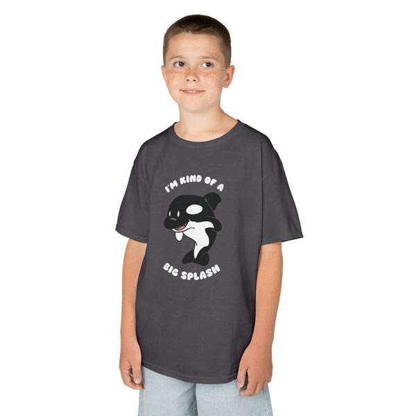 Kid wearing a dark gray tee with playful orca design and slogan 'I'm Kind of a Big Splash'.