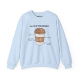 Light blue sweatshirt featuring a coffee cup with 