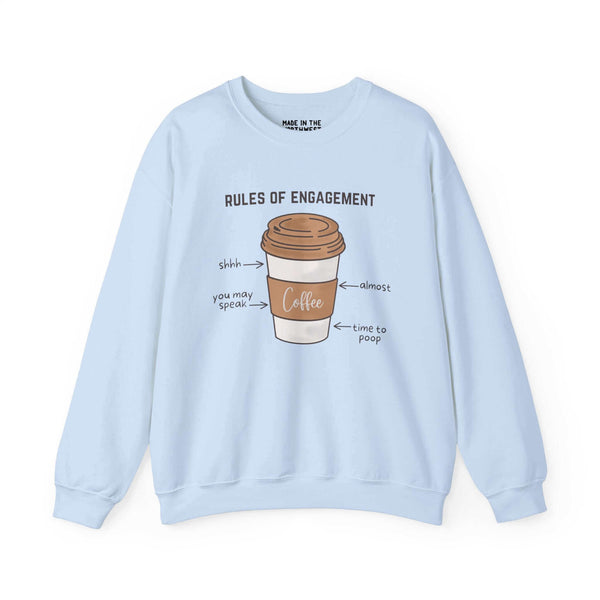 Light blue sweatshirt featuring a coffee cup with "Rules of Engagement" and humorous coffee lover phrases in the PNW style.