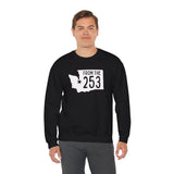 Model wearing a black sweatshirt with 'From the 253' and Washington state silhouette, showcasing Tacoma pride.