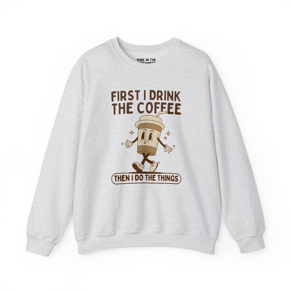 Cozy sweatshirt with coffee-themed design: 'First I Drink the Coffee Then I Do the Things'.
