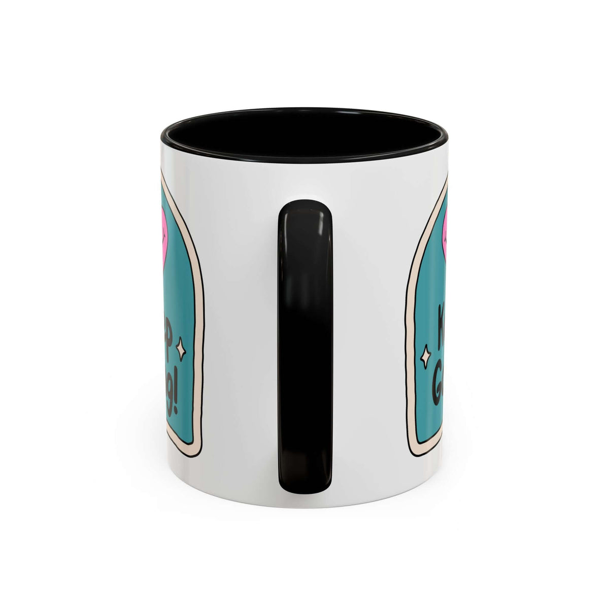 Keep Going Mug featuring a cheerful design with a pink heart and hand-lettered message on a ceramic surface.