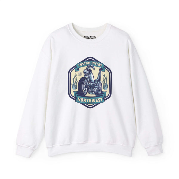 White sweatshirt featuring a 'Custom Cycles Northwest' motorcycle design, ideal for motorcycle enthusiasts seeking comfort and style.