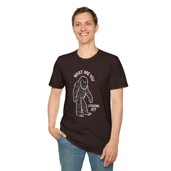 Man wearing a black What Are You Looking At T Shirt featuring a humorous sasquatch graphic.